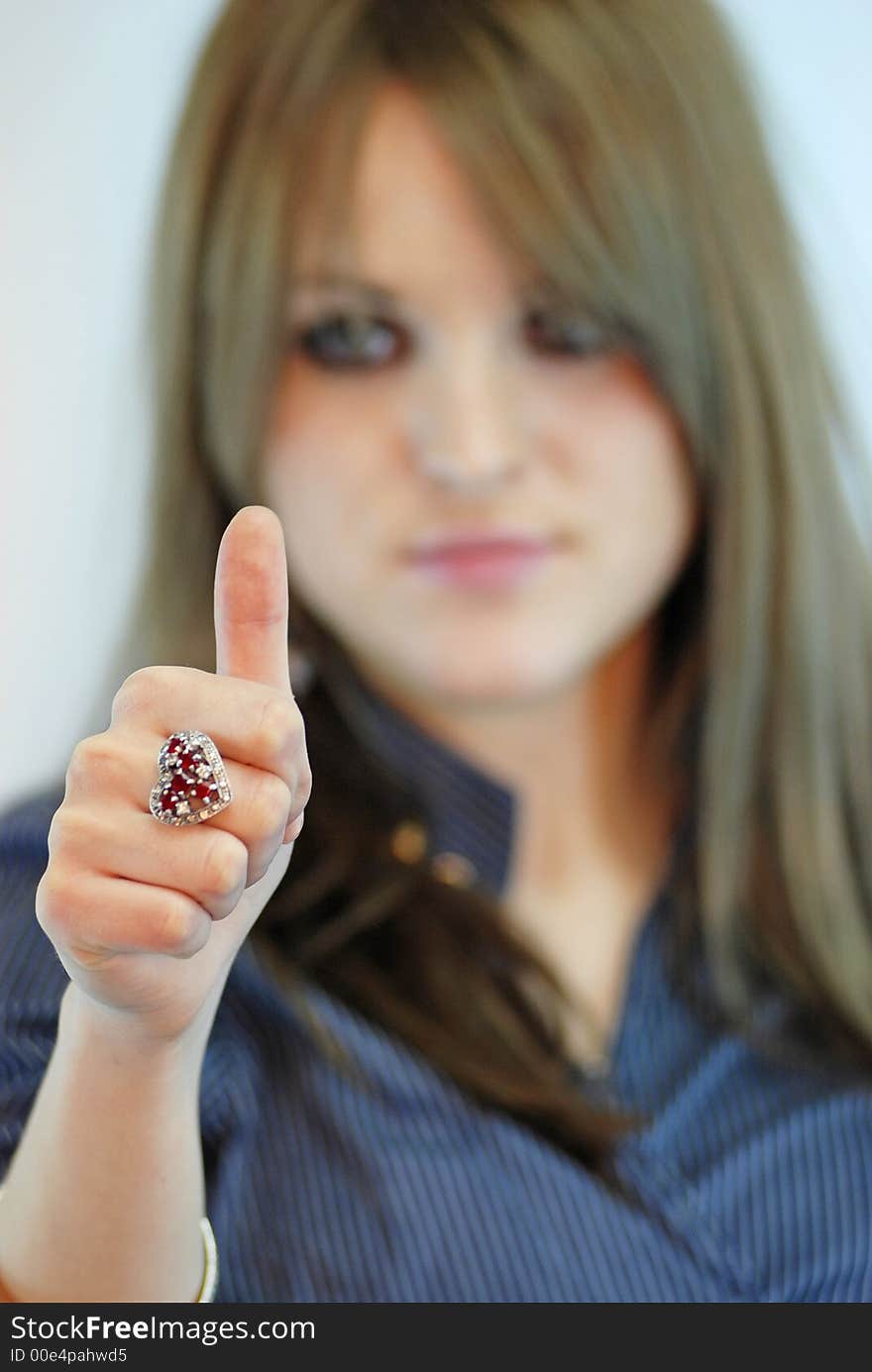 Female with finger up sign. Female with finger up sign