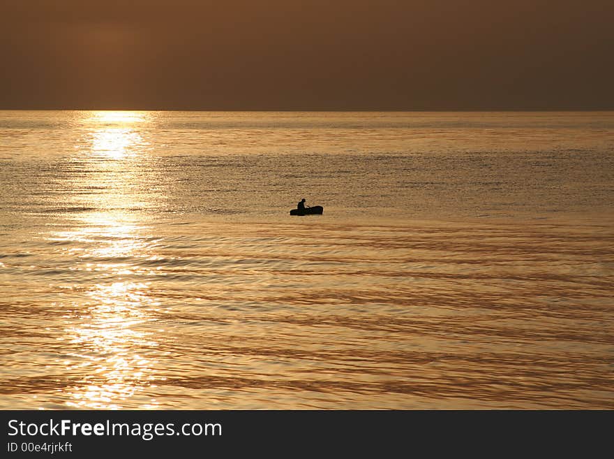 Small boat in the first sun rays