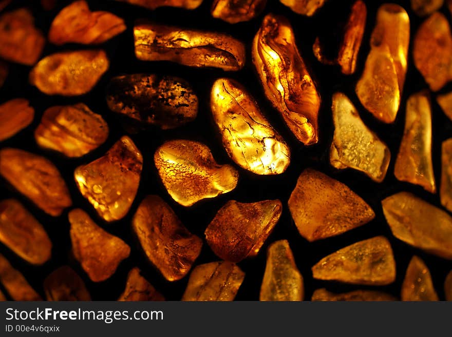 Amber; background; baltic; decoration; glass, gold; jewellery, lamp; ornament, poland; sea; stained; stone;. Amber; background; baltic; decoration; glass, gold; jewellery, lamp; ornament, poland; sea; stained; stone;