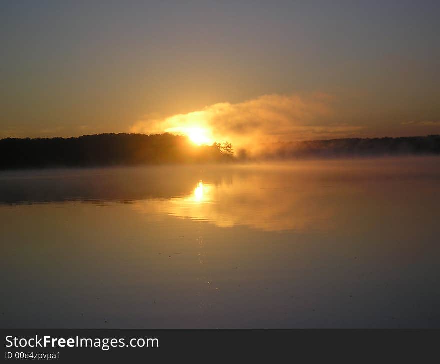 Sunrise over stony lake in shelby, MI. 

. Sunrise over stony lake in shelby, MI.