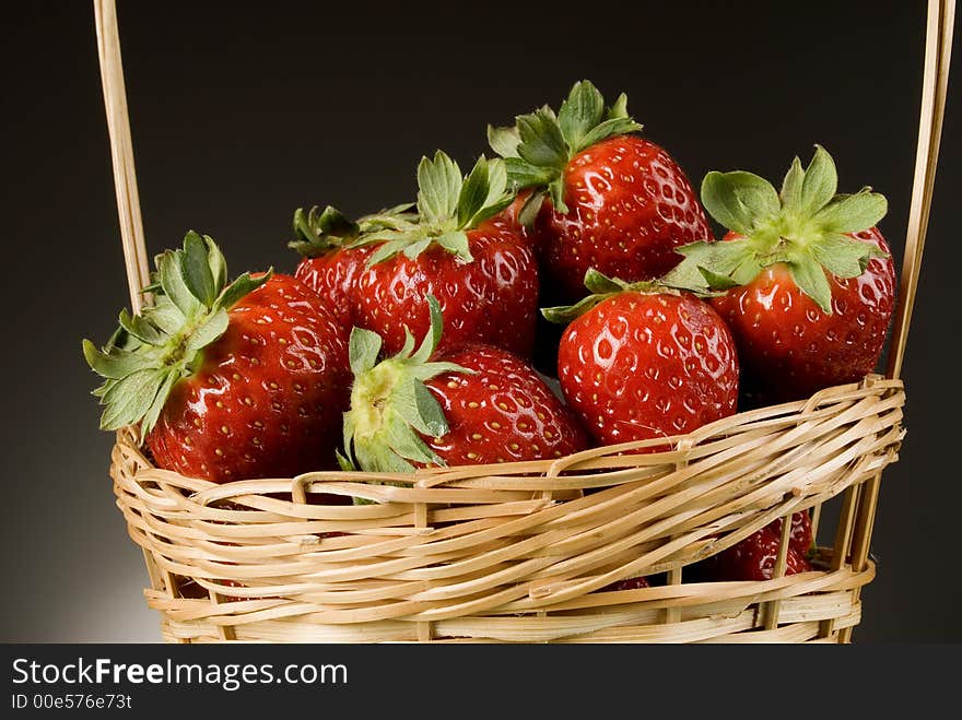 Fresh red strawberries on green background