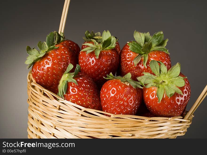 Fresh red strawberries on dark background