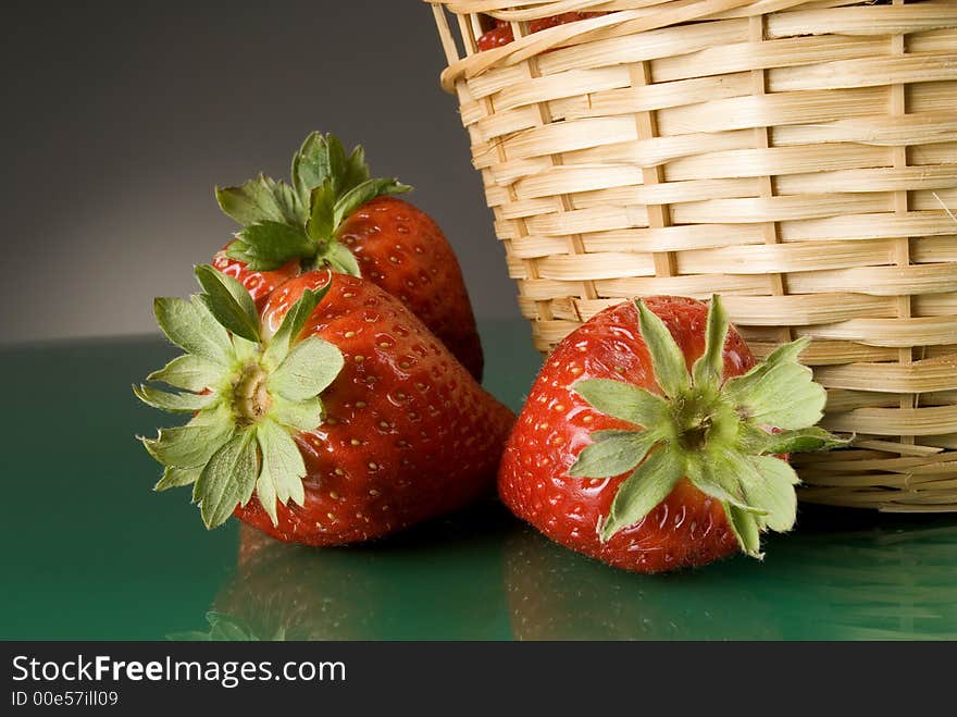 Fresh red strawberries on dark background