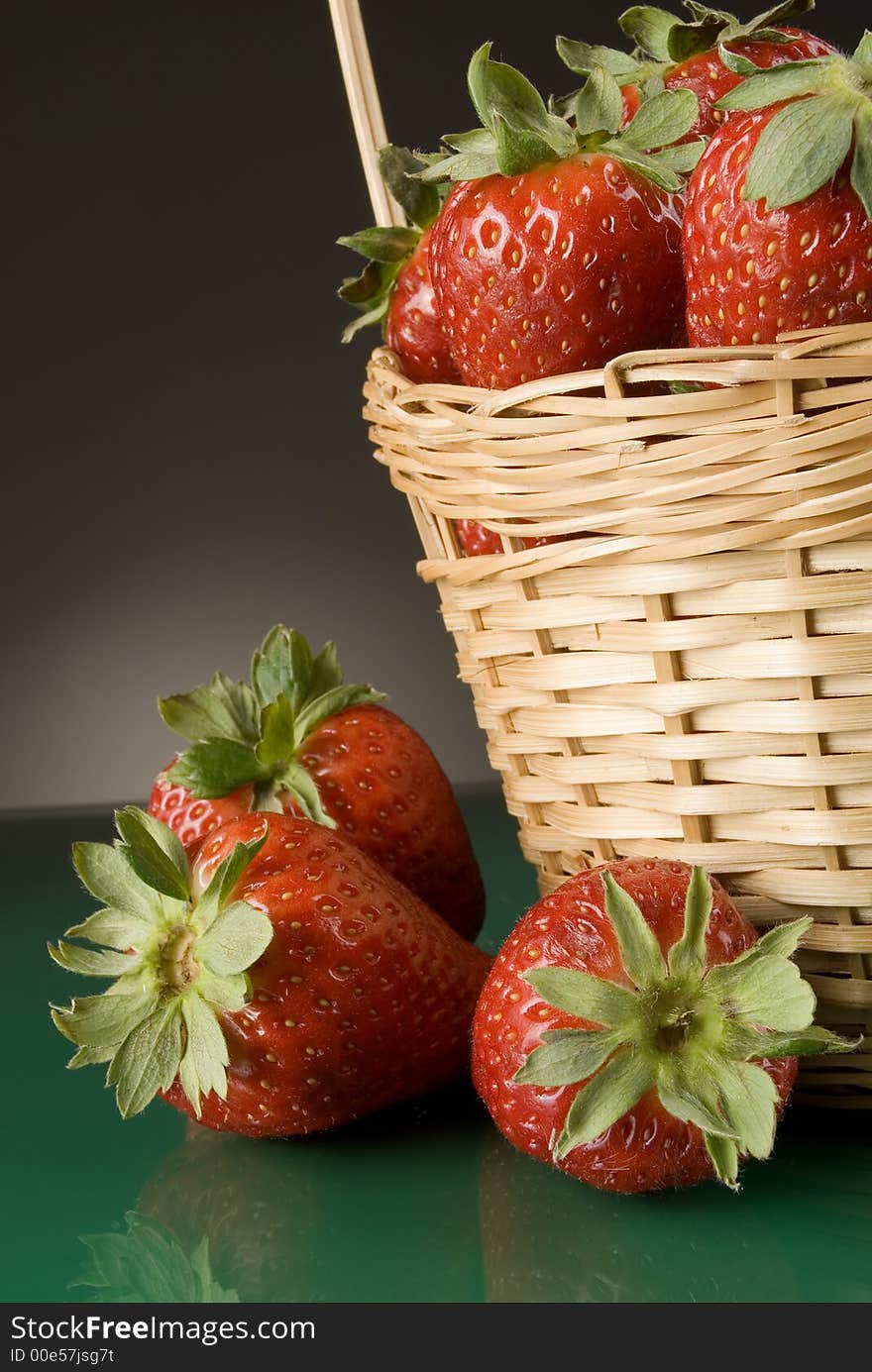 Fresh red strawberries on dark background