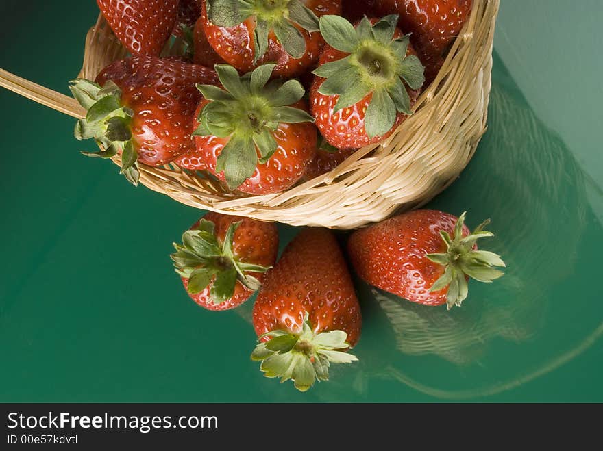 Fresh red strawberries on green background