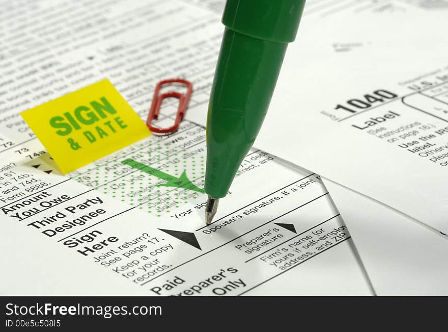 Photo of a Tax Forms and a Pen - Tax Related. Photo of a Tax Forms and a Pen - Tax Related