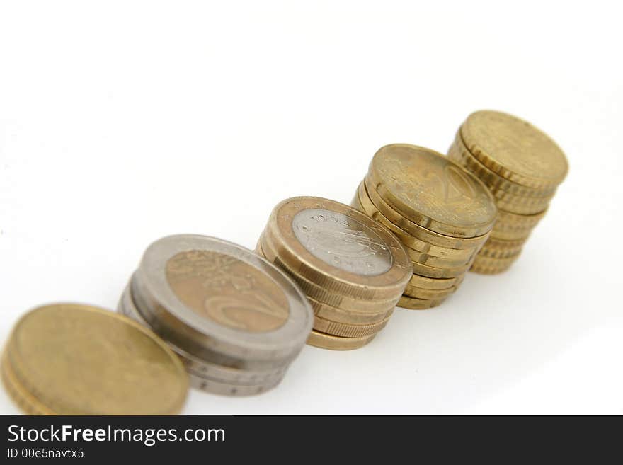 Stacks coins on white background