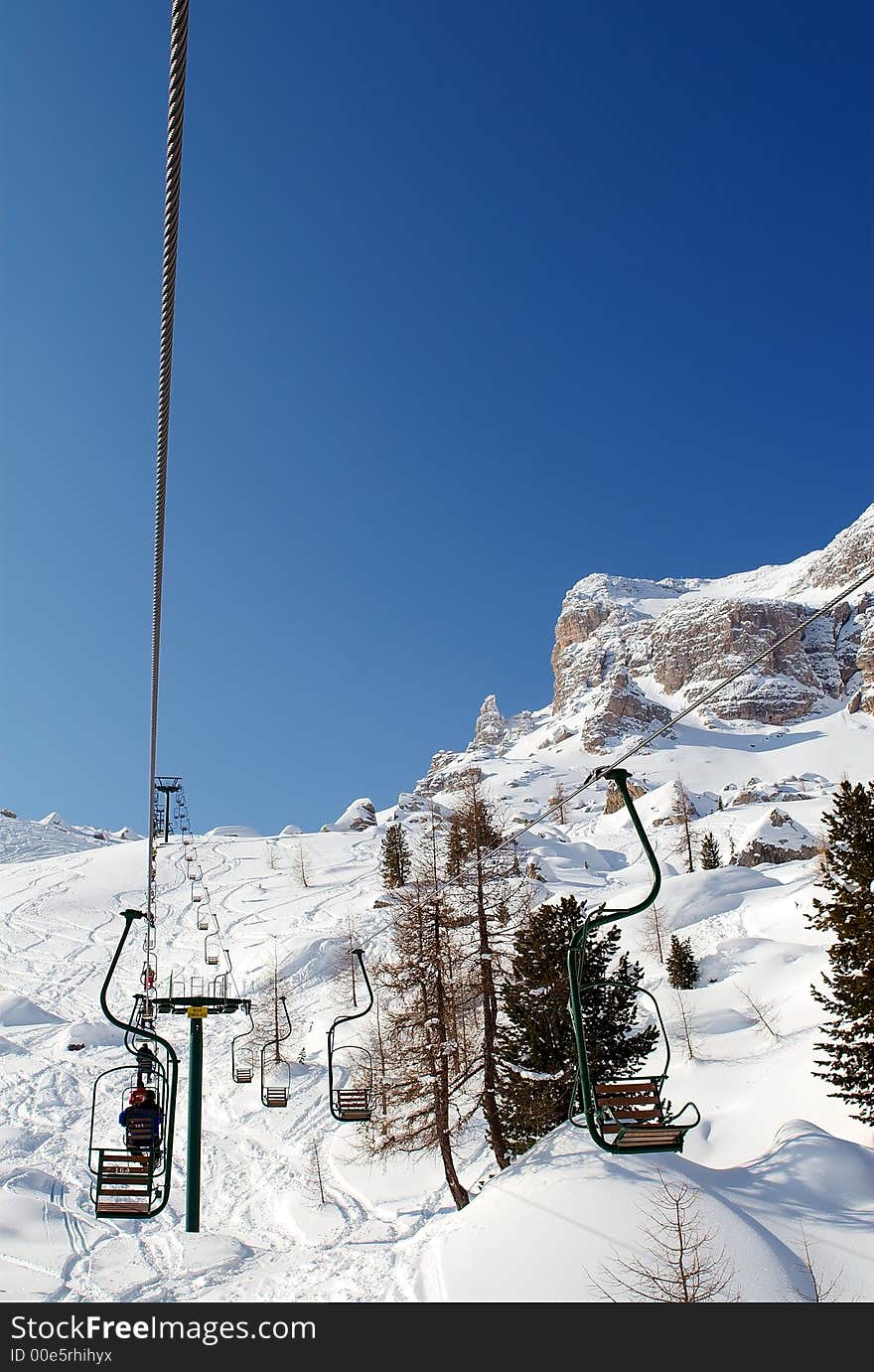 Single-seat chairlift in Dolomites. Single-seat chairlift in Dolomites