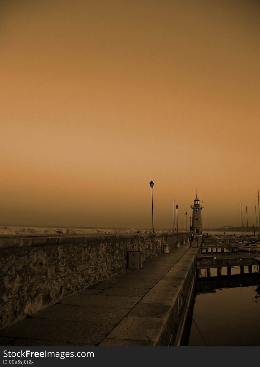 A lighthouse at sunset in Italy