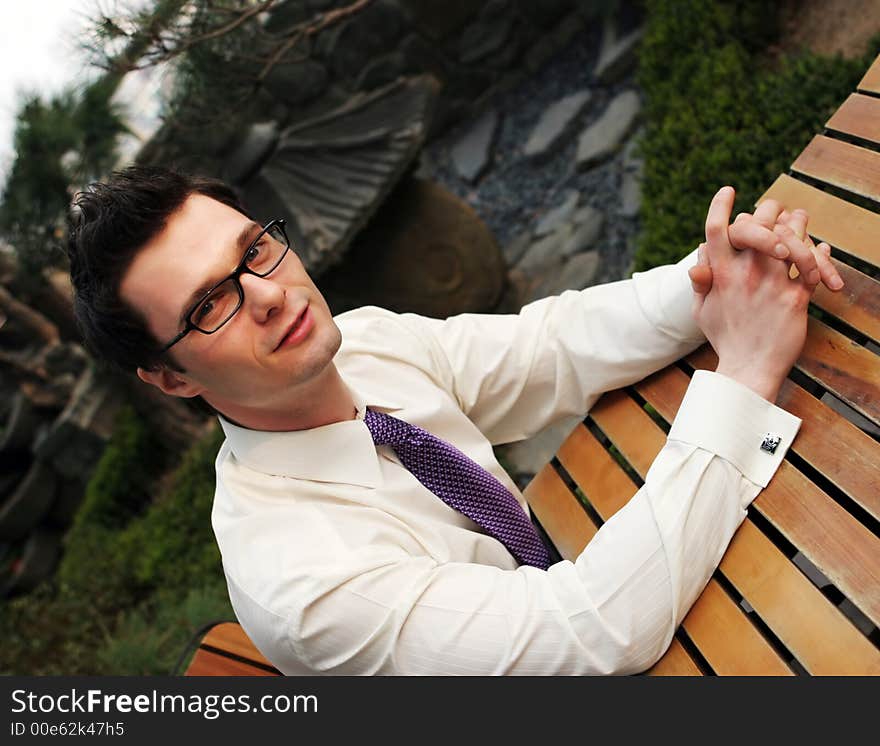 Businessman takes a break from work - happy and successful. Businessman takes a break from work - happy and successful