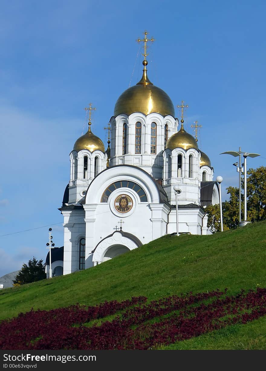 White christian church on a slope of a hill. White christian church on a slope of a hill