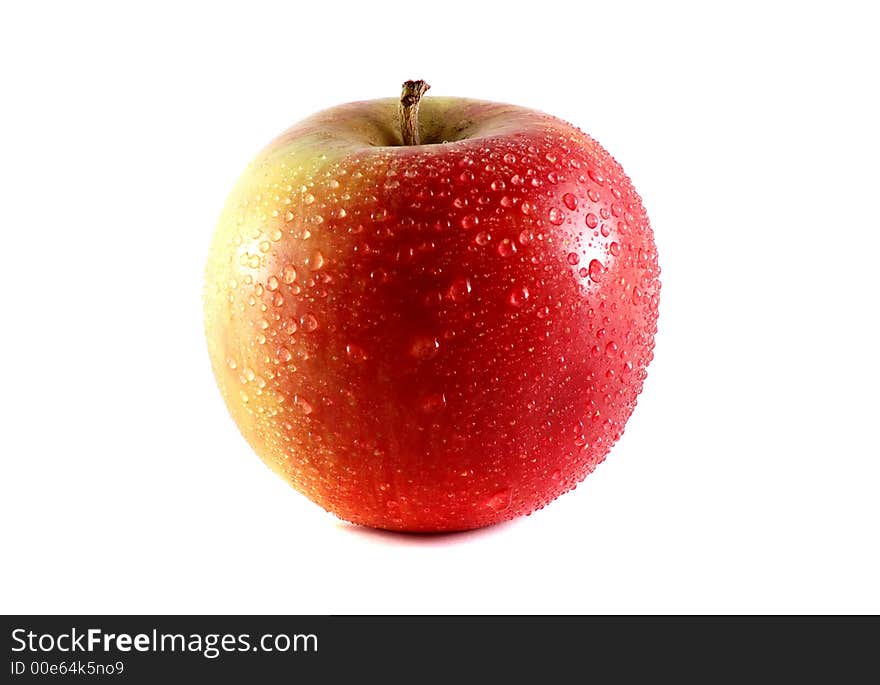 Photo of isolated fresh red apple with dew.