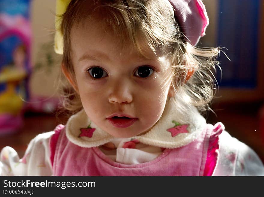 Cute little girl looking into the camera