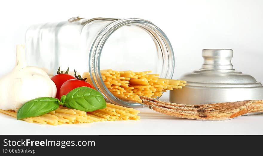 Basic ingredients for a simple italian pasta on a white background