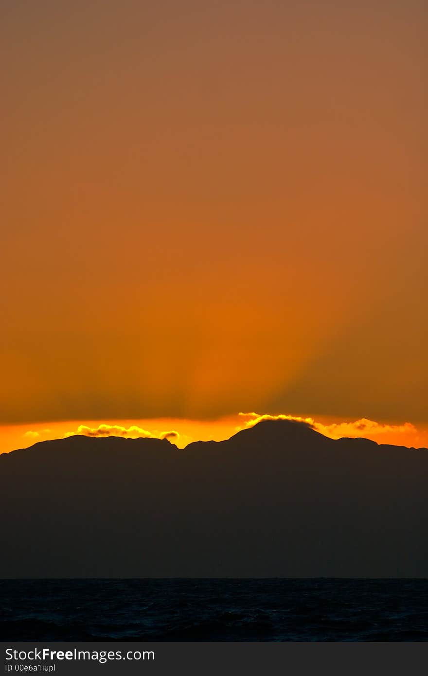 Orange sunrise from Kalkbay in the direction of Hangklip