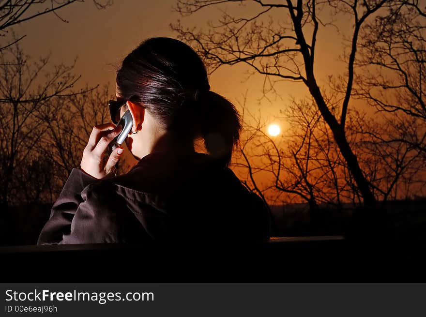 Photo of pretty female with cell phone. Photo of pretty female with cell phone.