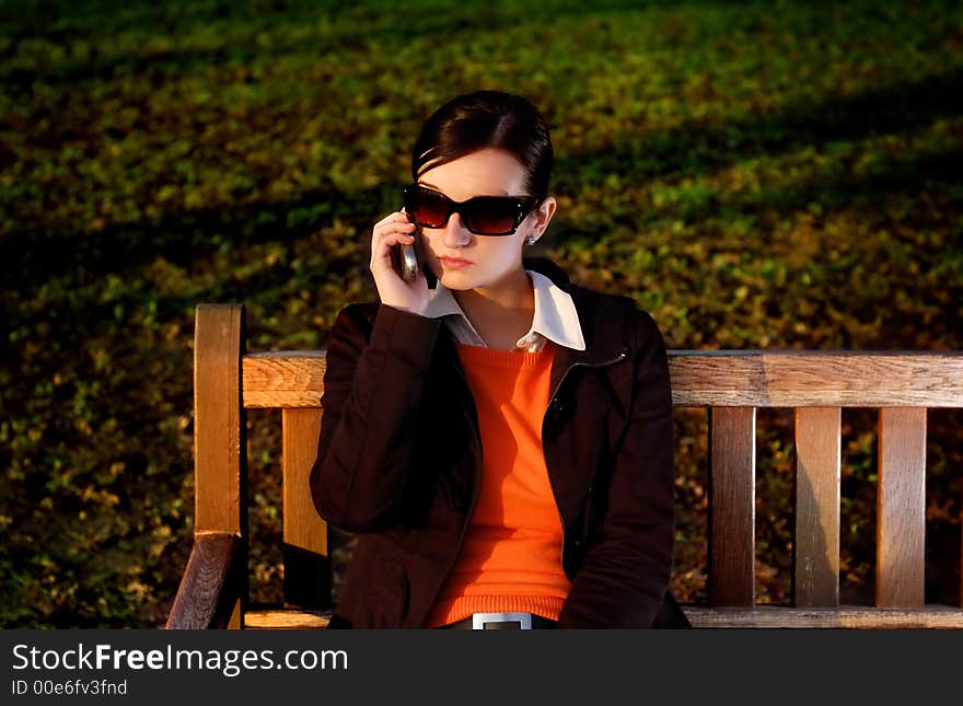 Photo of pretty female with cell phone. Photo of pretty female with cell phone.