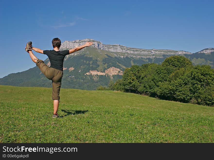 Woman of it making a exercise of balance in mountain. Woman of it making a exercise of balance in mountain