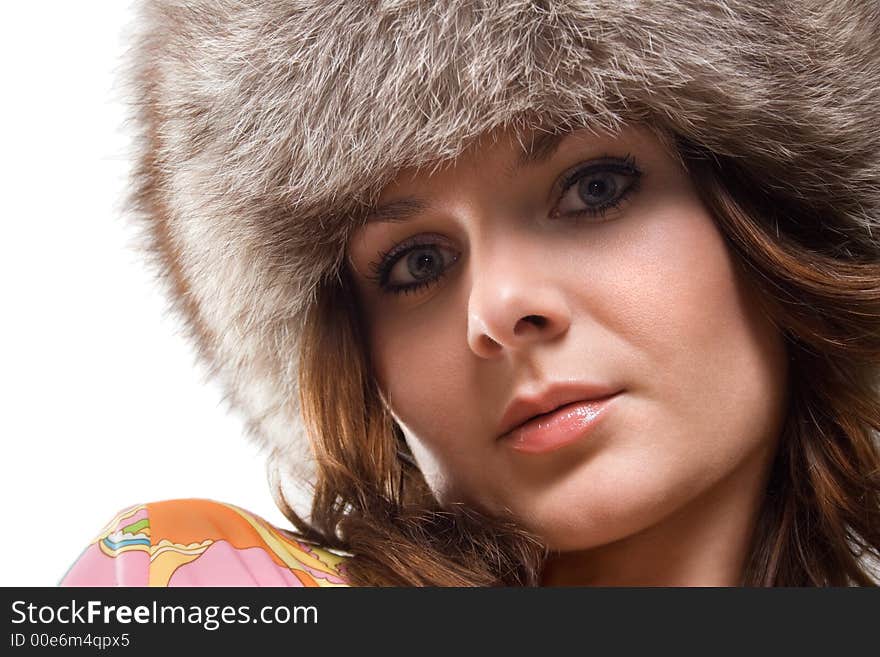 Portrait of a white beautiful woman in a fur hat. Portrait of a white beautiful woman in a fur hat