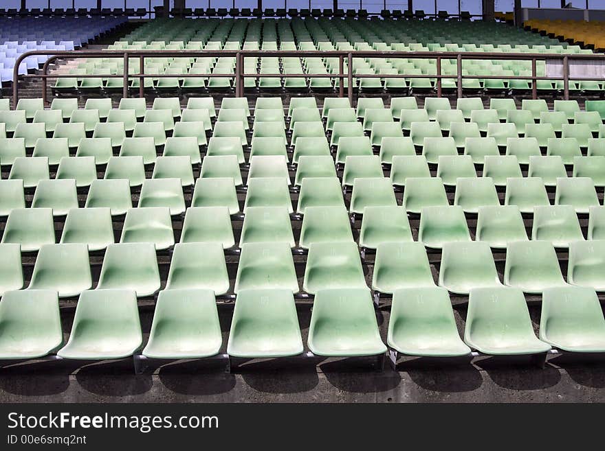 Many Empty Seats In Rows In An Outdoor Stadium. Many Empty Seats In Rows In An Outdoor Stadium