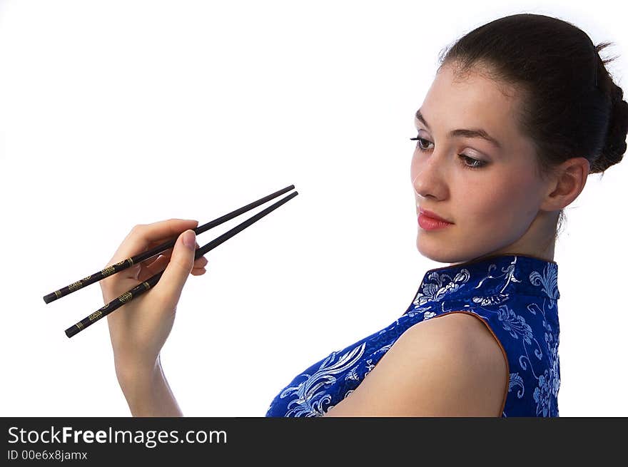 White girl with chopstick on the white background. White girl with chopstick on the white background