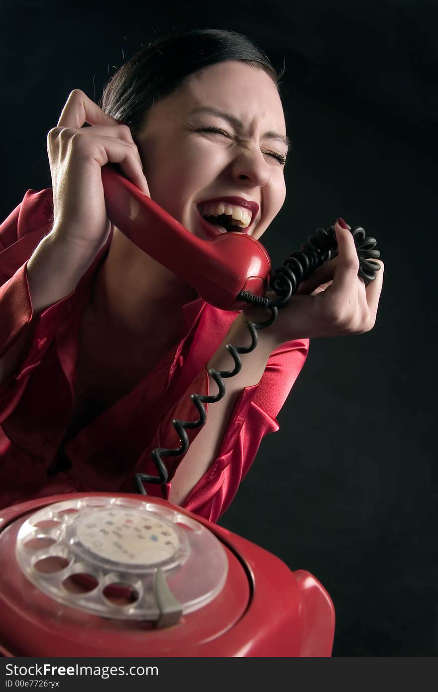 Girl is smiling in the conversation by phone. Girl is smiling in the conversation by phone