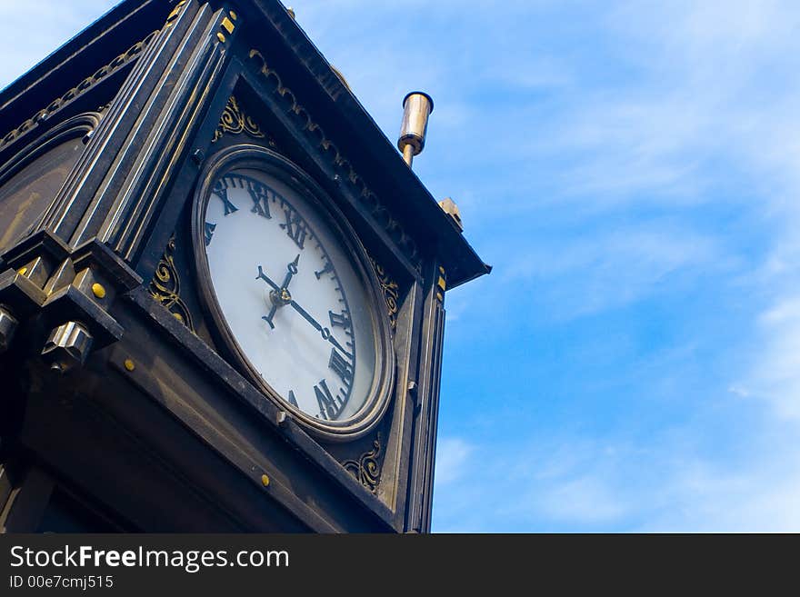 Ancient hours on a background of the blue sky