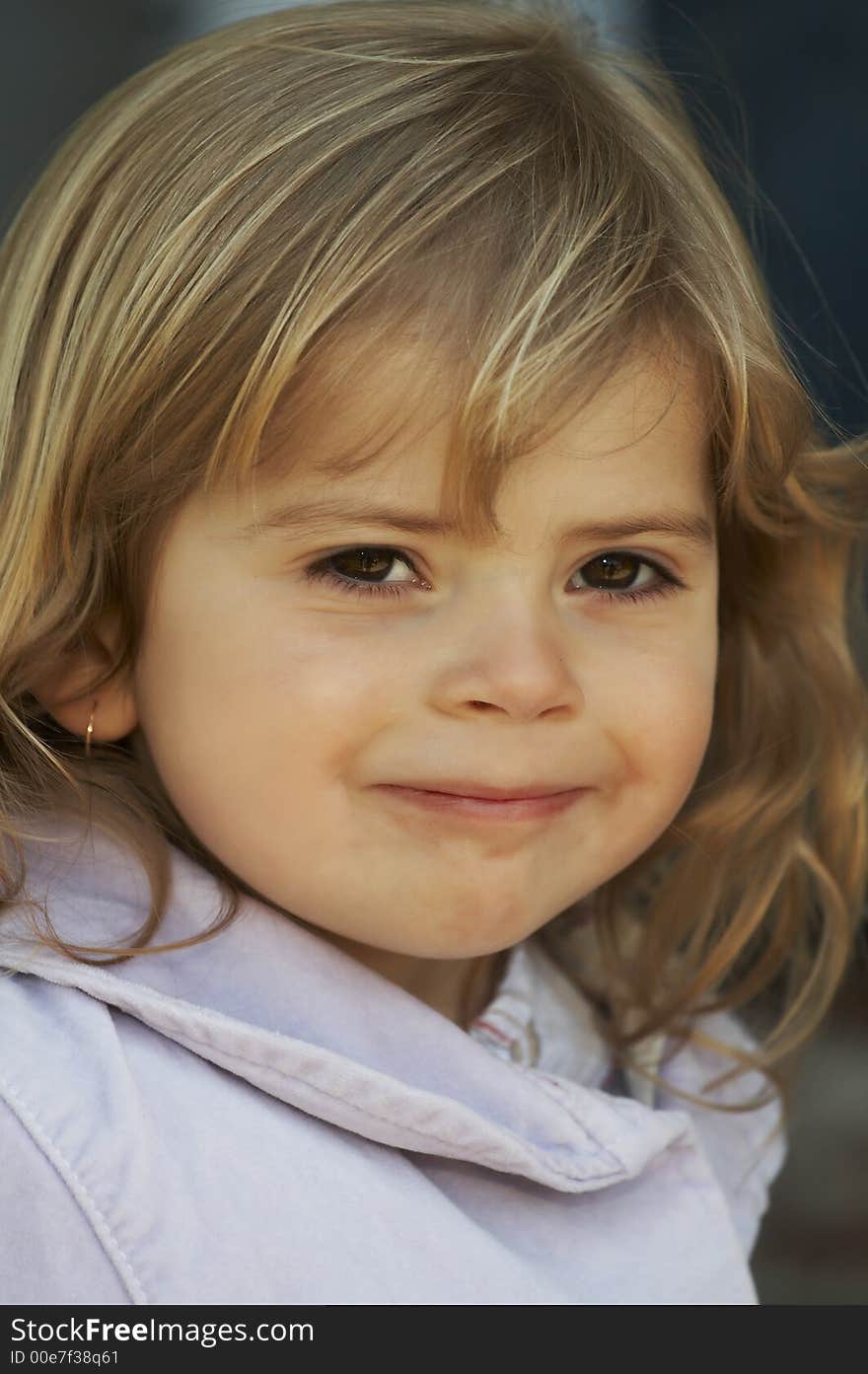 Young blond haired girl smiling