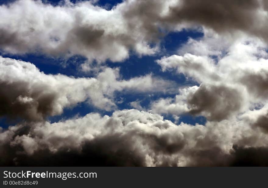 Blue sky with white and dark clouds. Blue sky with white and dark clouds