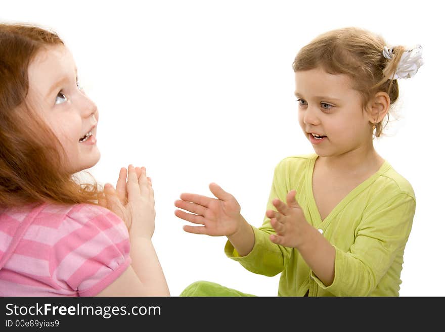 Two little girls play, isolate over white