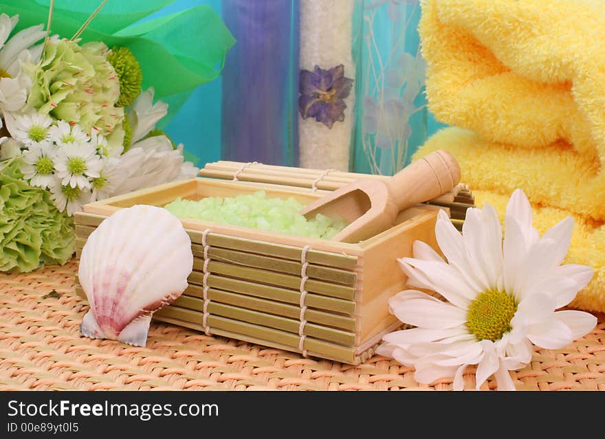 Bath Salts with Flowers and Towel on Blue Background. Bath Salts with Flowers and Towel on Blue Background