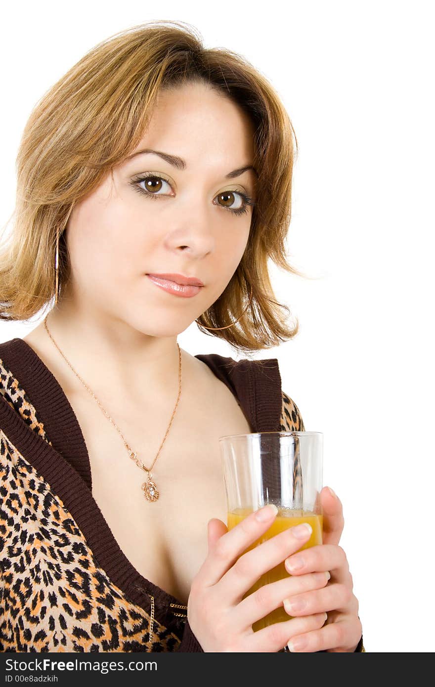 Beautiful girl keeps in hand glass with juice isolated over white