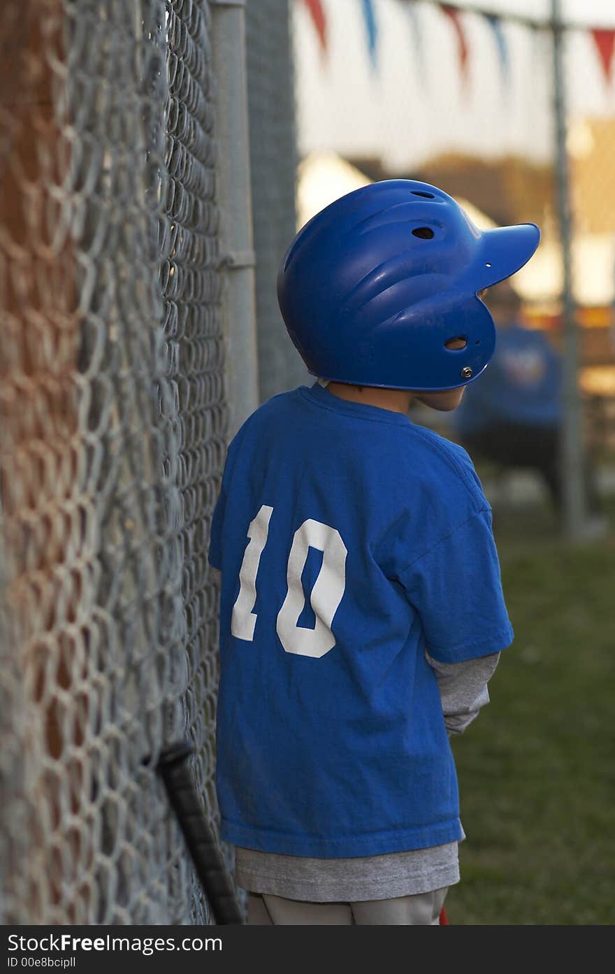 Young kid in baseball blue uniform. Young kid in baseball blue uniform