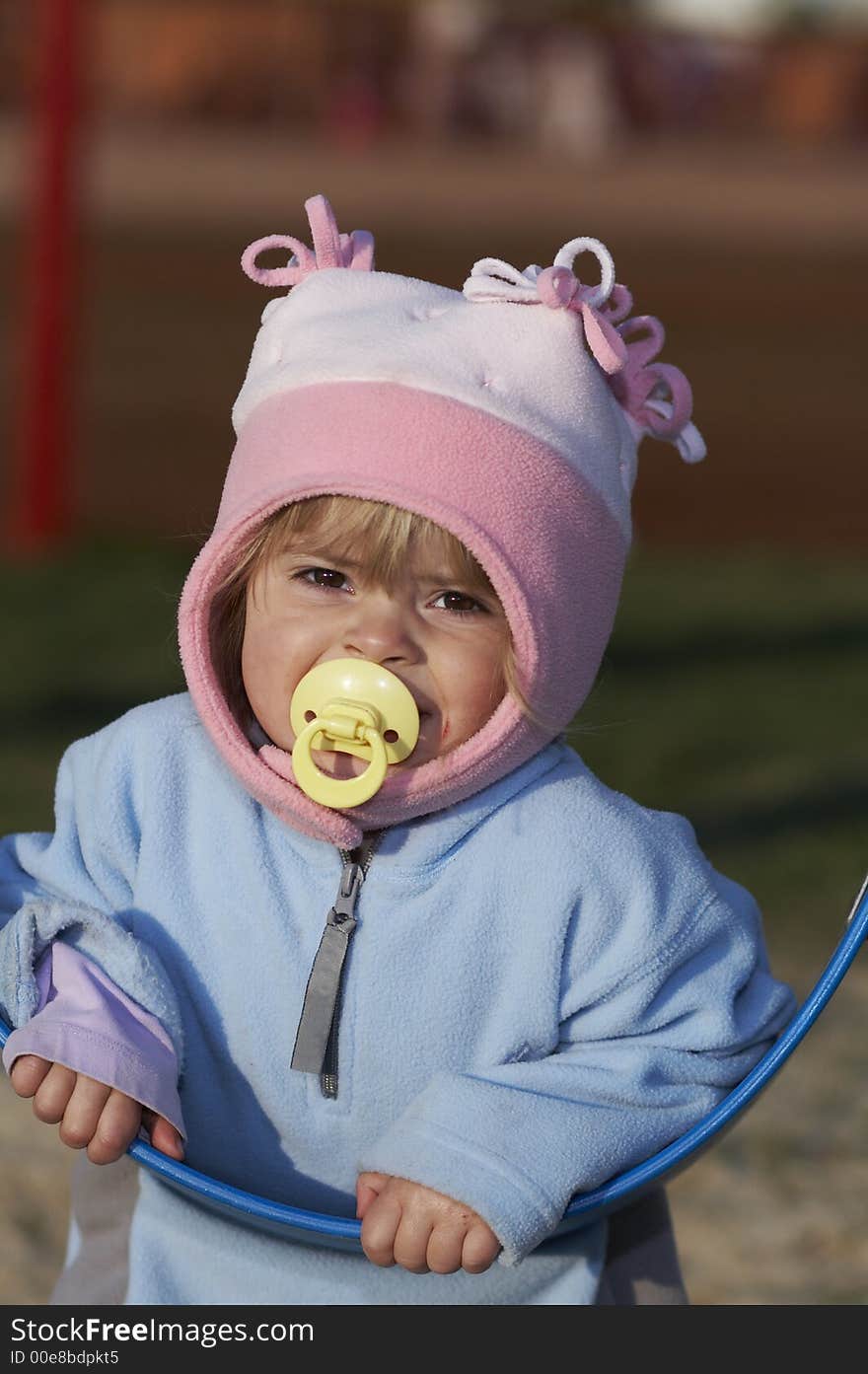 Pretty young blond girl on swing. Pretty young blond girl on swing