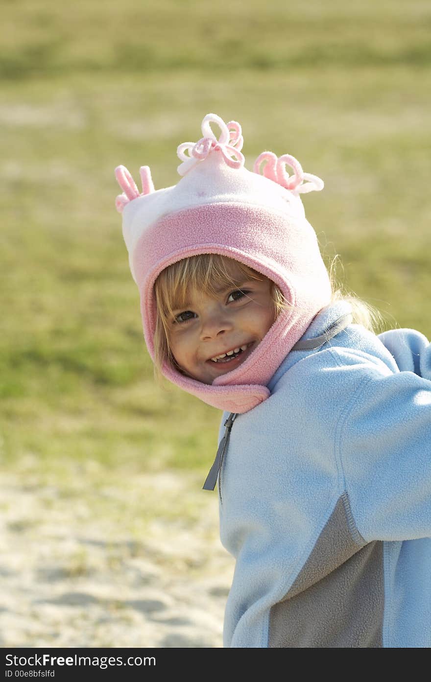 Pretty young blond girl smiling