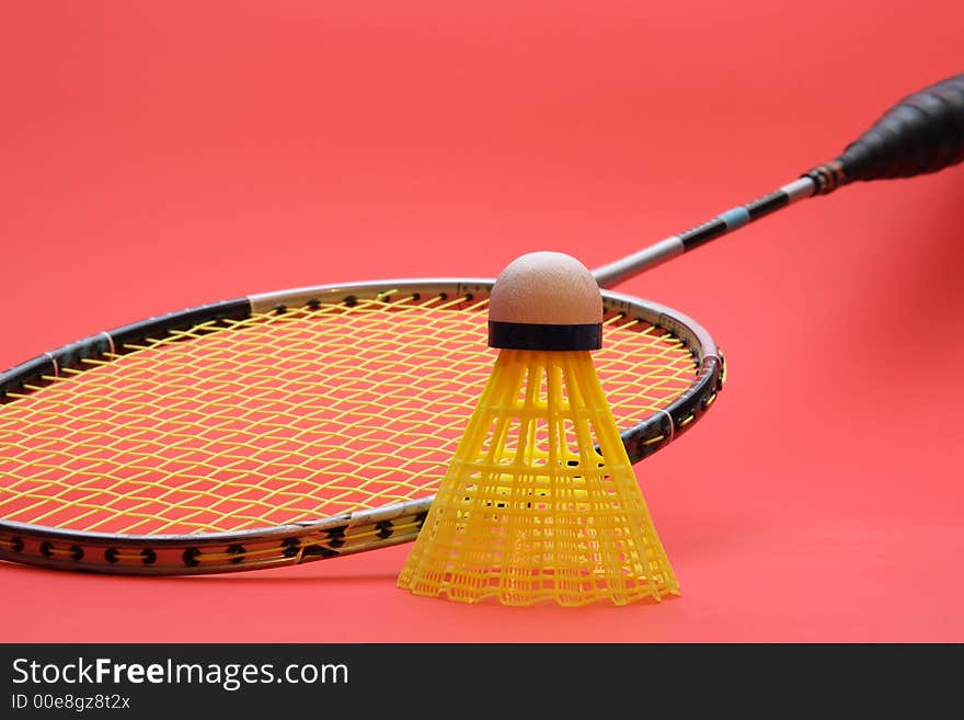 Badminton racket with red background