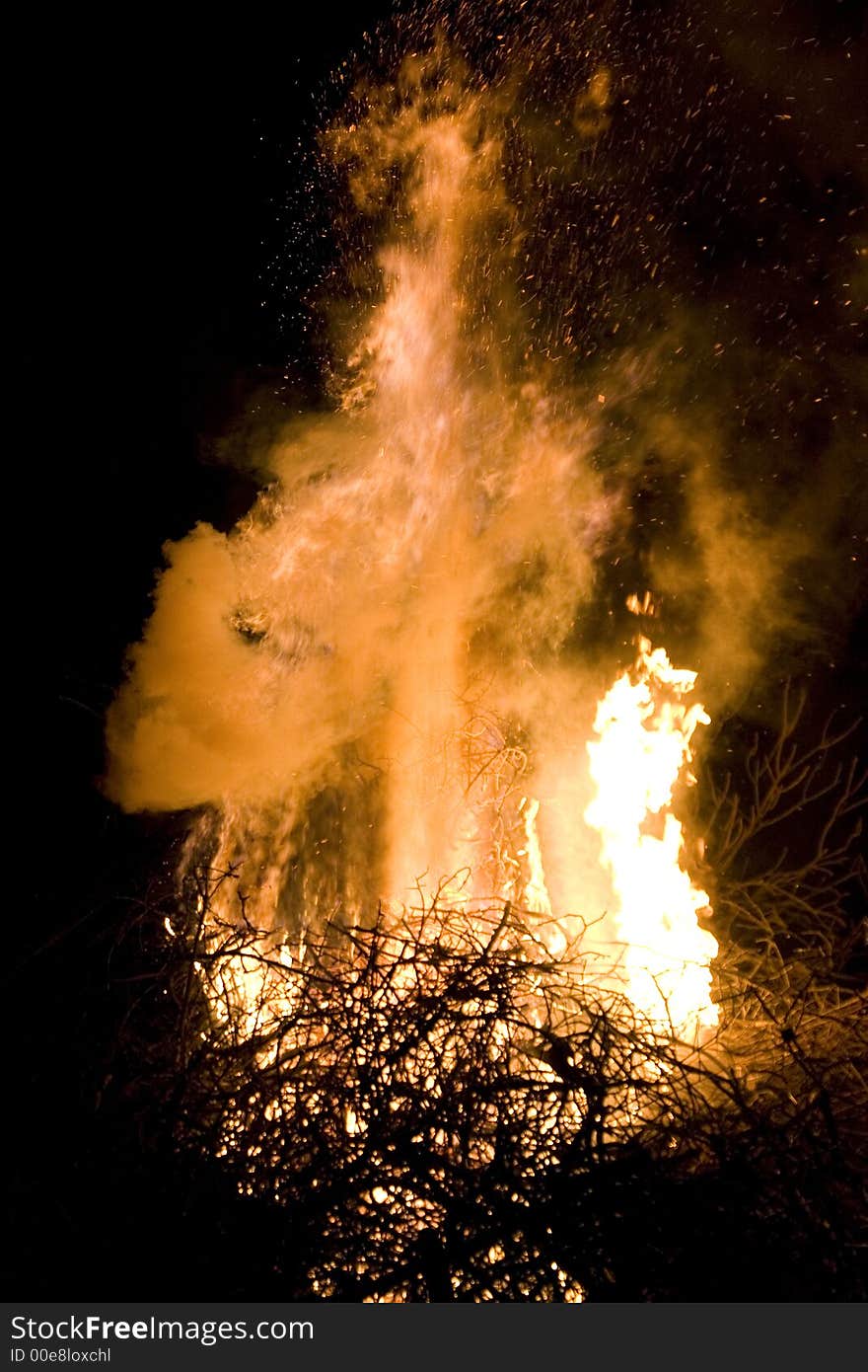 A photo of burning wood with detailed flames. A photo of burning wood with detailed flames