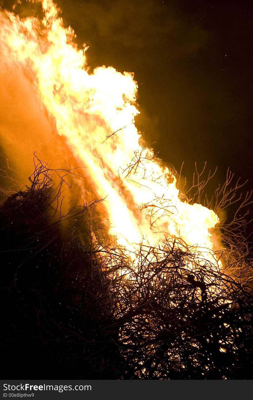 A photo of burning wood with detailed flames. A photo of burning wood with detailed flames