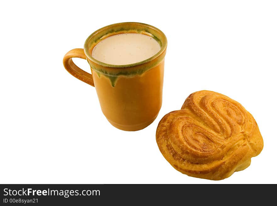 Cup of sour milk with sweet bun beside. Cup of sour milk with sweet bun beside