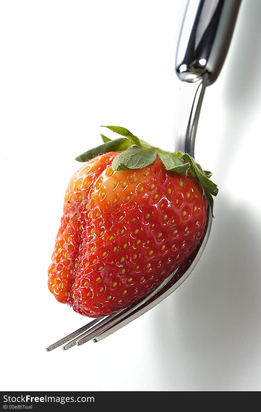 Delightful strawberry in strict laying on the fork. Delightful strawberry in strict laying on the fork