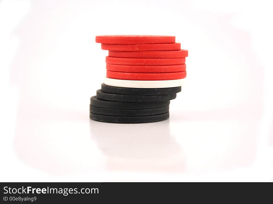 An image of red, white and black poker chips