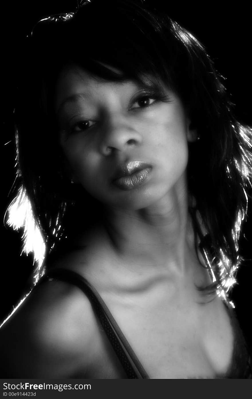 Beautiful young African American woman in black and white portriat. Beautiful young African American woman in black and white portriat.