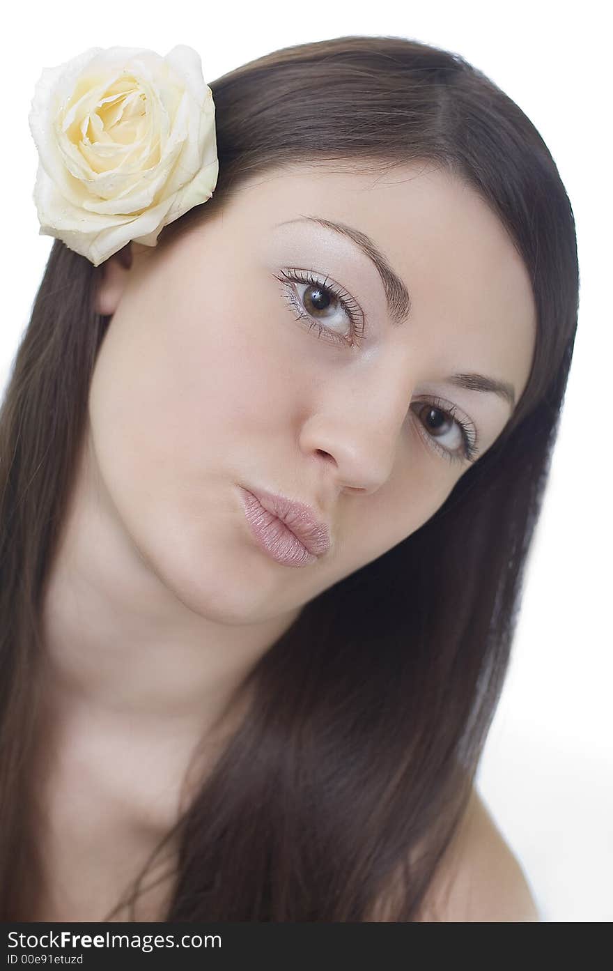 Girl with a white rose behind an ear