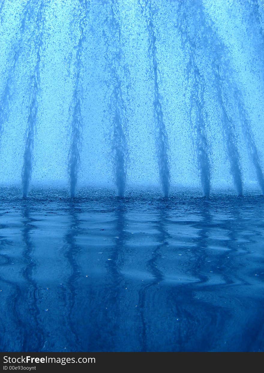 Water splashes rising high from the fountain. Water splashes rising high from the fountain