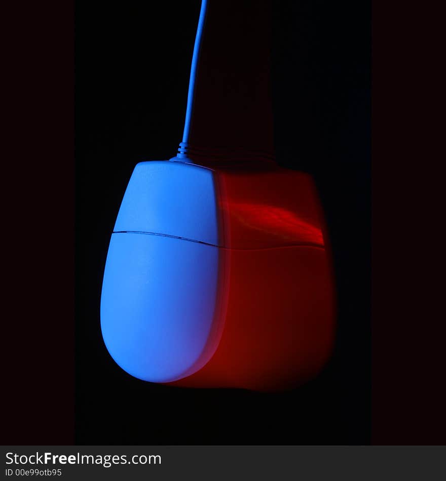 Swing mouse showing movement blur. Red and blue lights used. Swing mouse showing movement blur. Red and blue lights used.