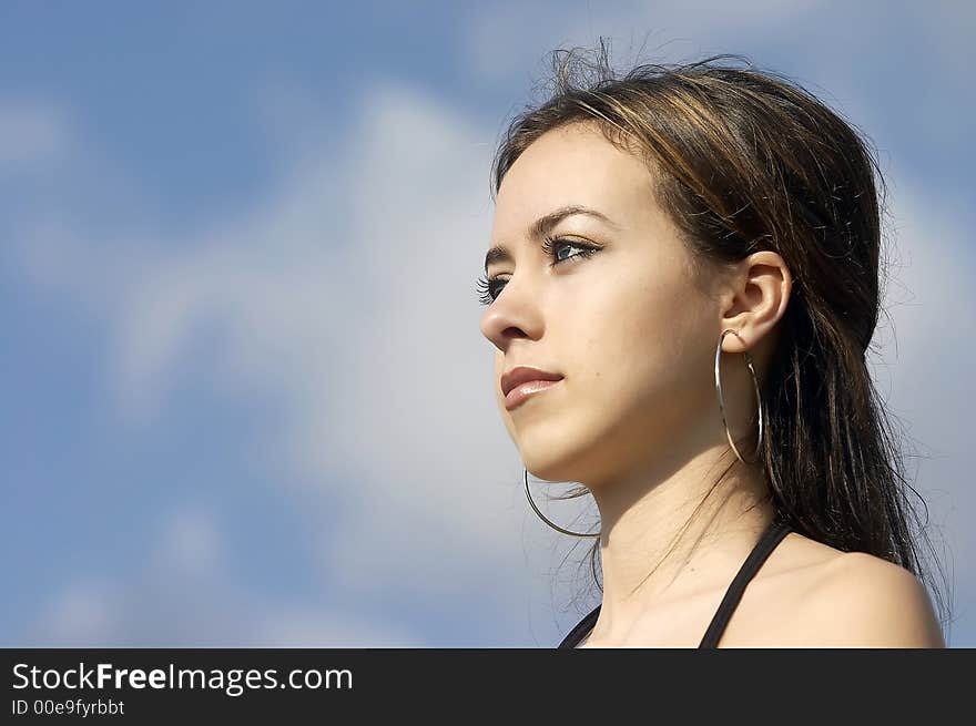 Attractive young businesswoman facing the future