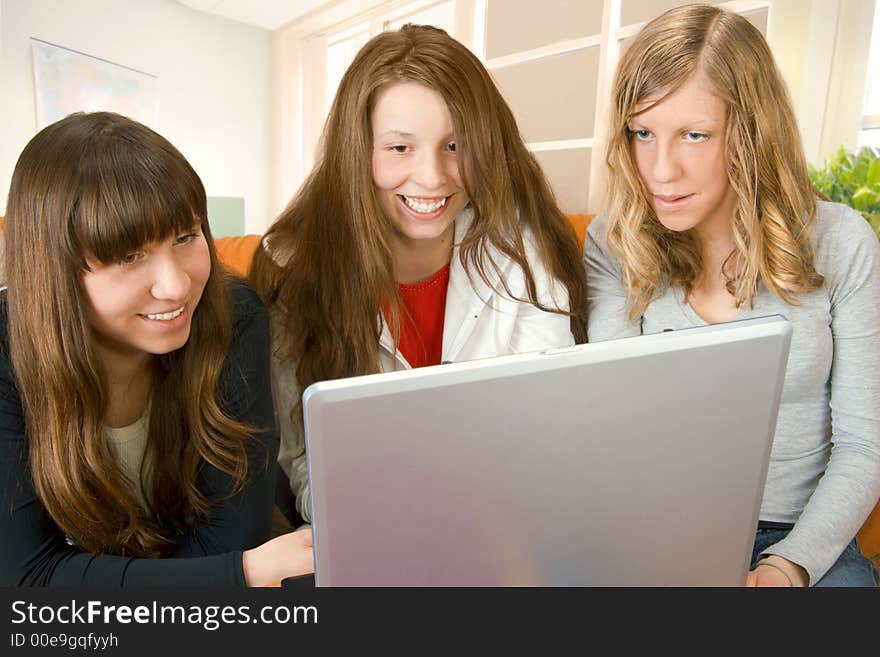 Beautiful young women surfing the web. Beautiful young women surfing the web