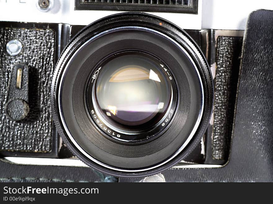 Old SLR camera lens shot isolated on a white background