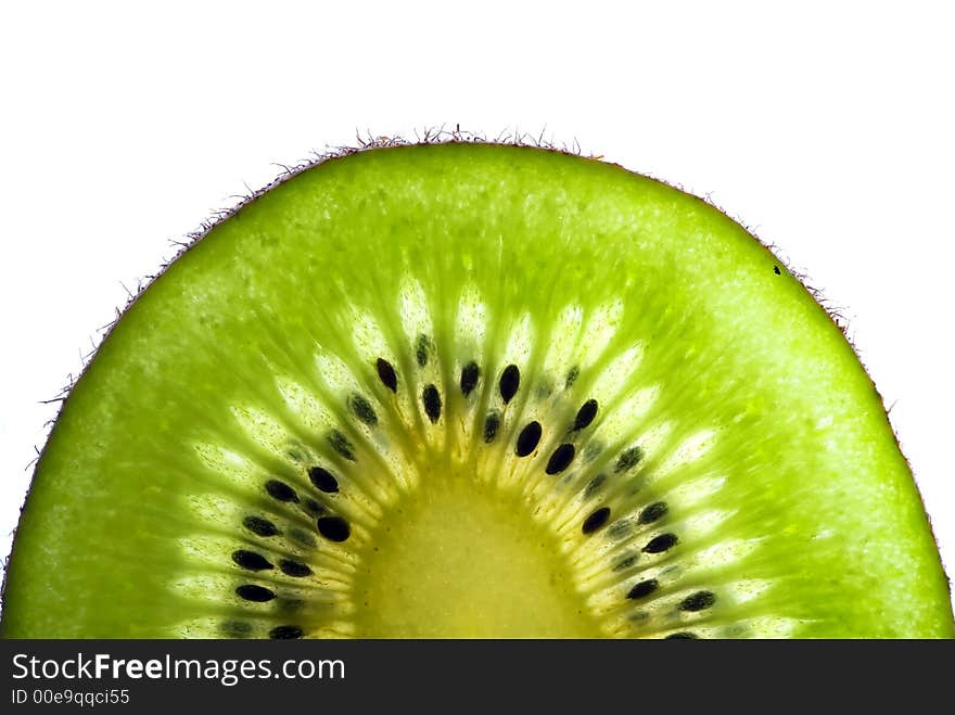 Lushes green slice of a kiwi isolated on white background