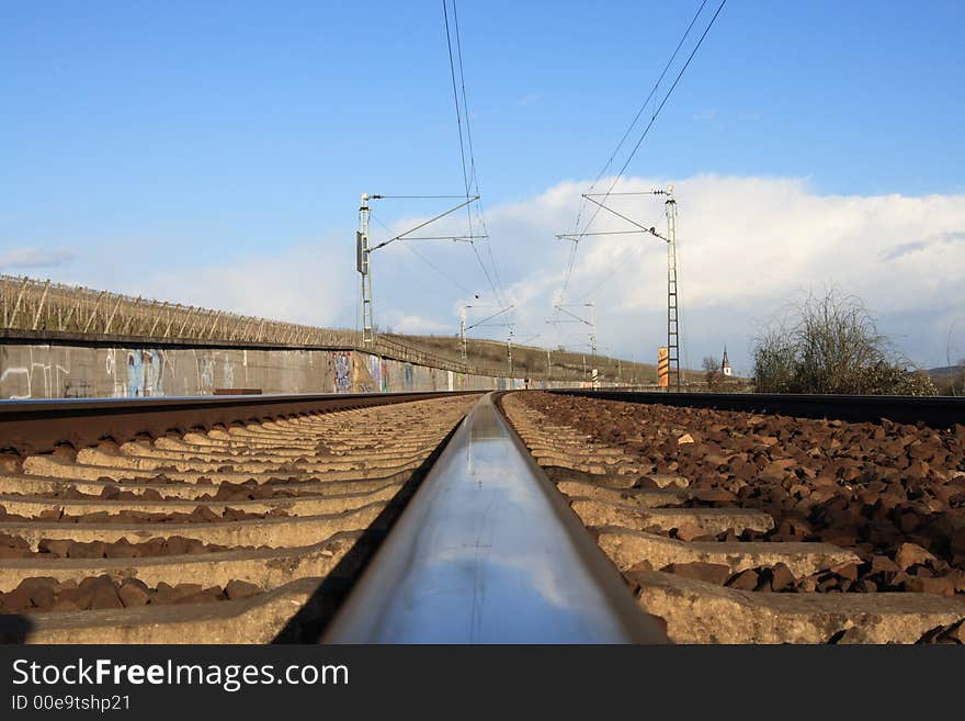 A track of a railway with blue sky